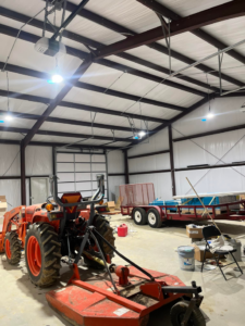 High bay lighting and garage door opener wiring installed in a large workshop by JMD Electric, LLC in O'Fallon, MO.