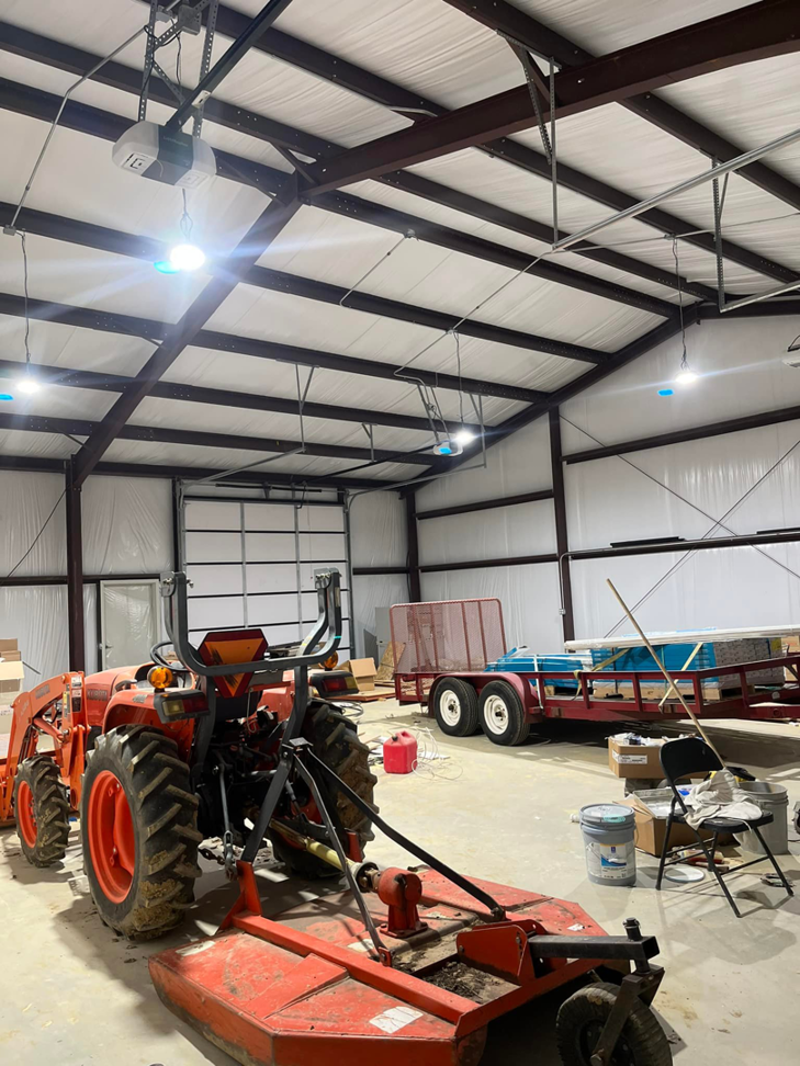 High bay lighting and garage door opener wiring installed in a large workshop by JMD Electric, LLC in O'Fallon, MO.