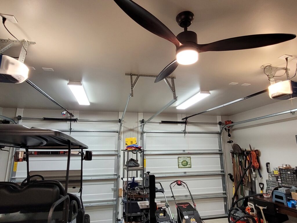 Garage with new fluorescent lighting and a ceiling fan installed by Lindsey and Son Electric, LLC in Summerville, SC