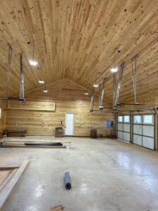 Overhead lighting and garage door opener wiring installed in a large garage by Prime Time Electric in Rock Hill, SC.