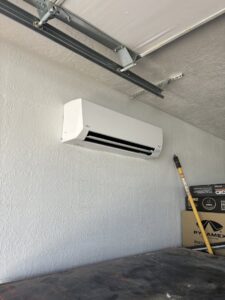 A newly installed mini-split AC unit in a garage by Buddy's Refrigeration LLC in Mesquite, NV.