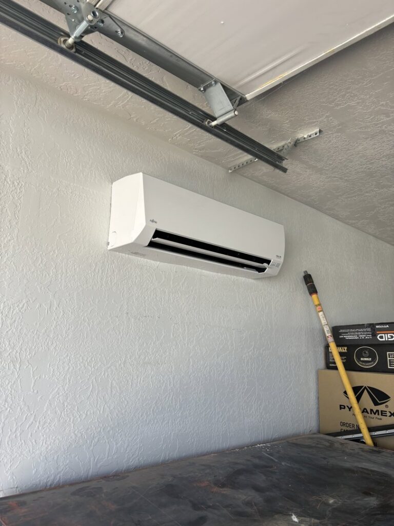 A newly installed mini-split AC unit in a garage by Buddy's Refrigeration LLC in Mesquite, NV.