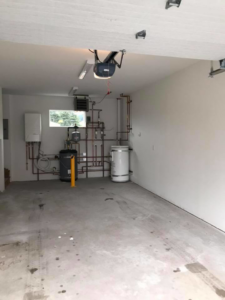 Electrical installations including lighting and a garage door opener in a utility room by Local Electric Inc. in Kodiak, AK