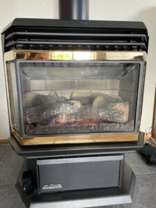 A modern gas fireplace insert with realistic logs and flames, installed by Nevada Heating Reno in Sparks, NV.