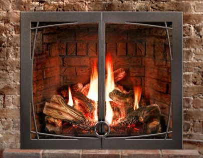 A gas fireplace insert with a decorative metal frame and burning logs, installed by North Central Service, Inc. in Minot, ND.