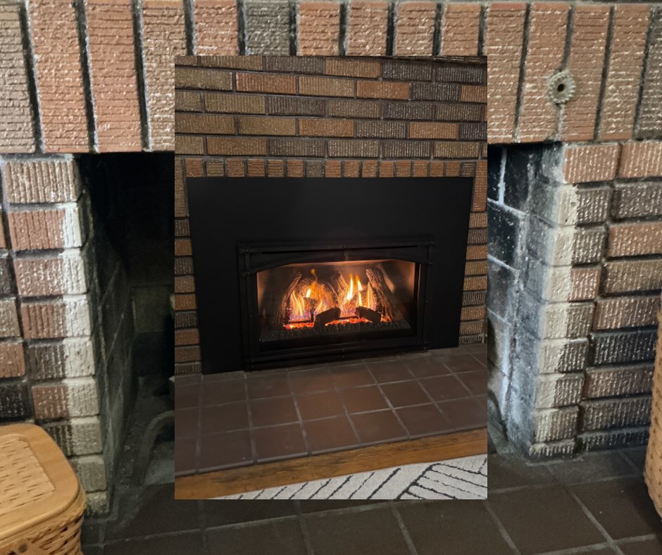 A newly installed gas fireplace insert with active flames by Spartan Heating, Cooling and Fireplaces in Cedar Rapids, IA