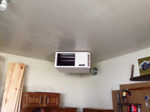 A cozy gas fireplace insert with a brick surround, installed by The Heating Guys in Fargo, ND.