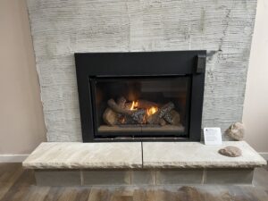 A newly installed gas fireplace with burning logs by True Comfort Heating and Cooling in Sherwood, AR.