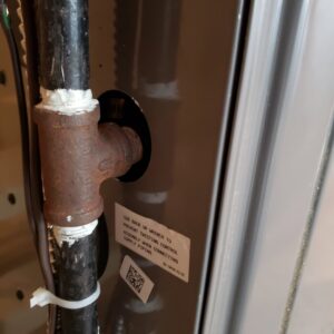 A gas line connection to a furnace or water heater, serviced by A-OK Heating & Cooling in Concord, GA.