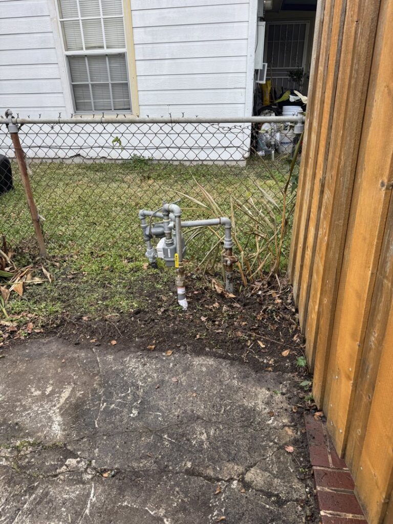 A gas meter and piping being prepared for connection to a new generator installation by Never Without Power Generators LLC in Huffman, TX.
