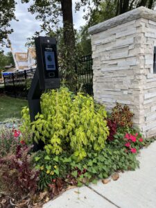 A gate access control system installed next to a stone pillar by Brothers Gate Operators and Services LLC in Olathe, KS.