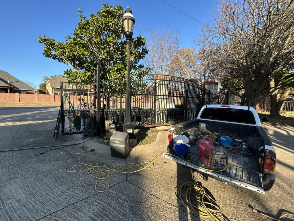 A work truck with equipment for gate opener installation or repair by Iron Fence Services, LLC in Lancaster, TX.