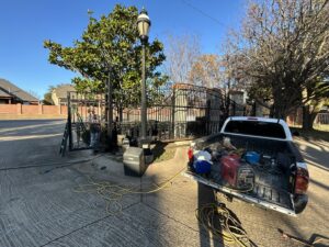 A work truck with equipment for gate opener installation or repair by Iron Fence Services, LLC in Lancaster, TX.