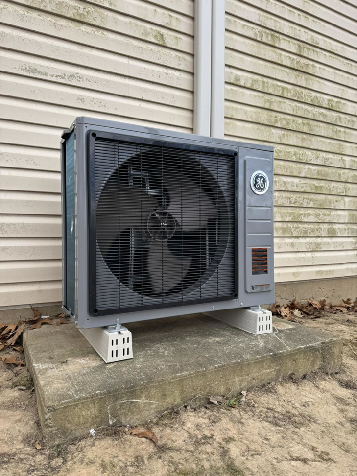 A new GE outdoor heat pump unit installed by Brown's Heating & Air Conditioning in Columbia, TN.