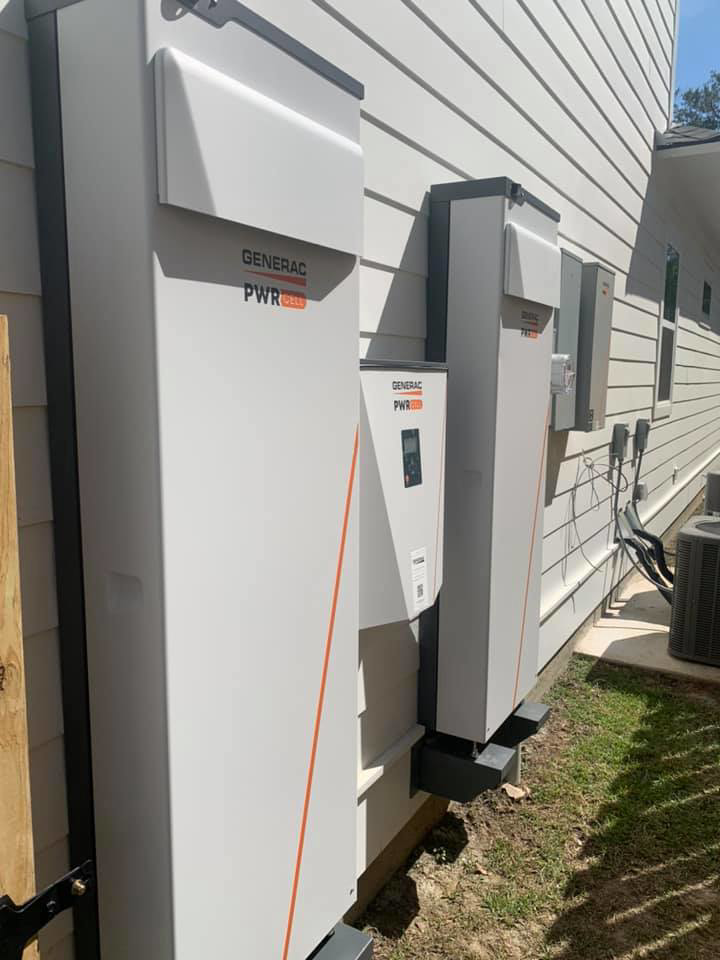 Generac PWRcell battery storage systems and an outdoor AC unit installed by Baton Rouge Air in Baton Rouge, LA