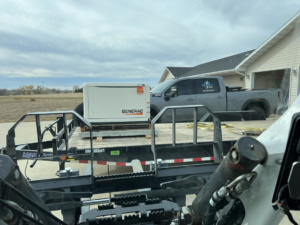 A Generac whole-home generator being delivered on a trailer by Bakken Electric in Saint Paul, MN.