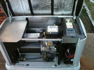 The engine and electrical components inside a Generac generator, serviced by Generator Experts of Oklahoma in Norman, OK.