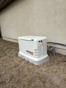 A newly installed Generac whole-home generator with gas lines connected by Never Without Power Generators LLC in Huffman, TX.