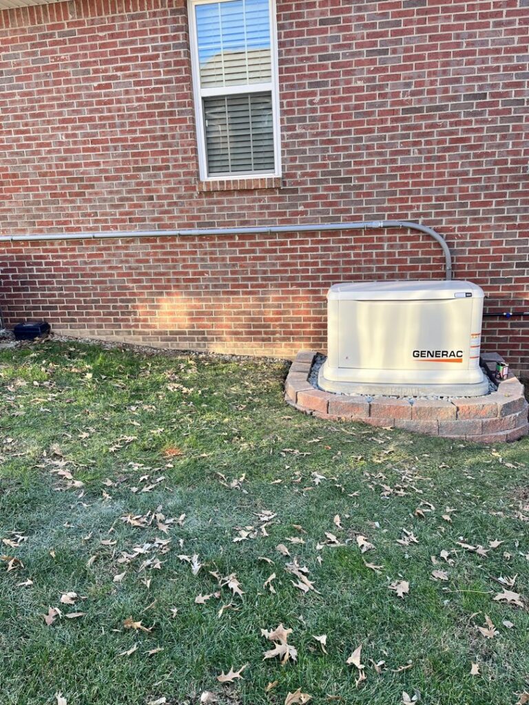 A Generac whole-home generator installed on a decorative stone base by Morris Electric Co. Inc. in Louisville, KY.