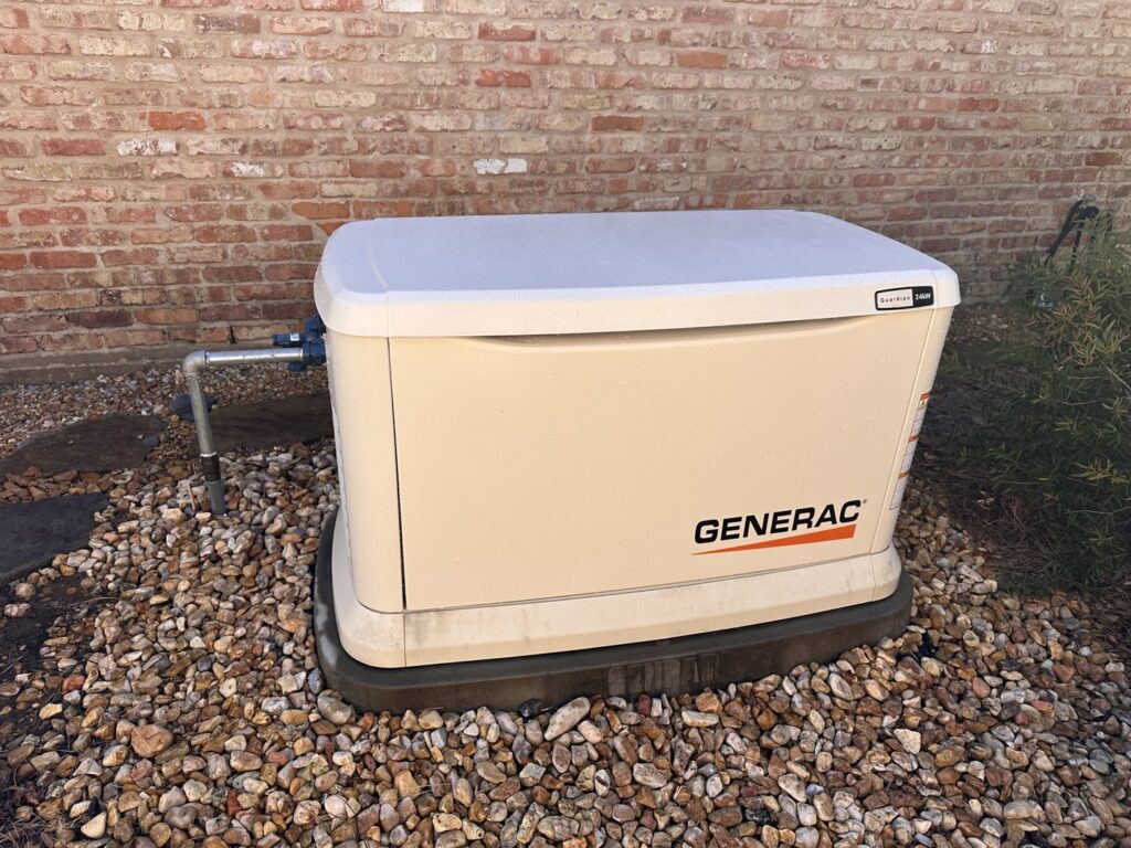 A Generac generator installation with visible gas line connection by Cenla Generators in Alexandria, LA.