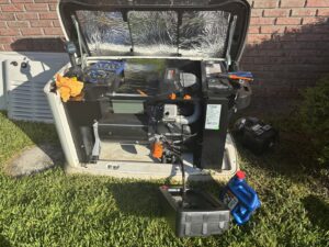 A Generac whole-home generator undergoing maintenance or repair by Tenax Electrical Company in Jacksonville, FL.