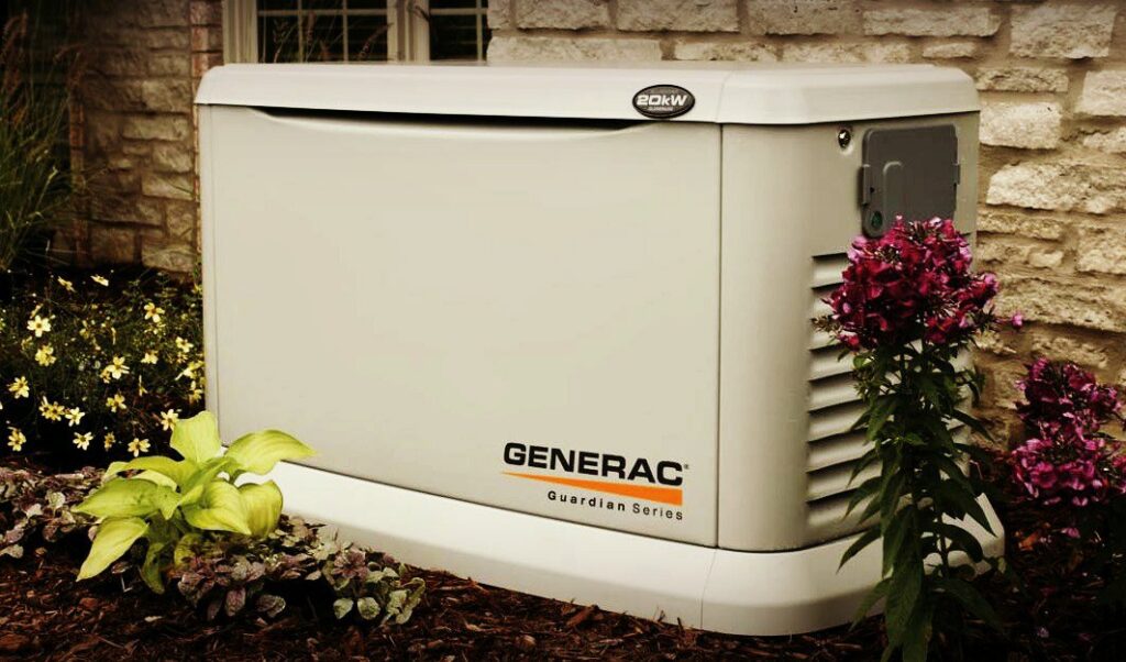 A Generac Guardian Series generator professionally installed in a landscaped yard by Denny's Electric in Healdsburg, CA.