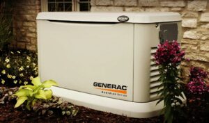 A Generac Guardian Series generator professionally installed in a landscaped yard by Denny's Electric in Healdsburg, CA.