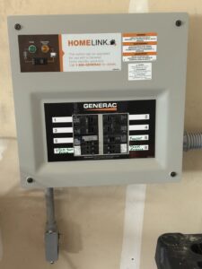 A Generac HomeLink transfer switch and main electrical panel installed by Denny Power Solutions in Virginia Beach, VA