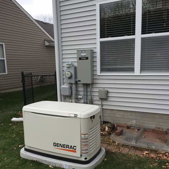 Generac standby generator with electrical connections installed by Crown Enterprises Electrical Contracting in Omaha, NE.