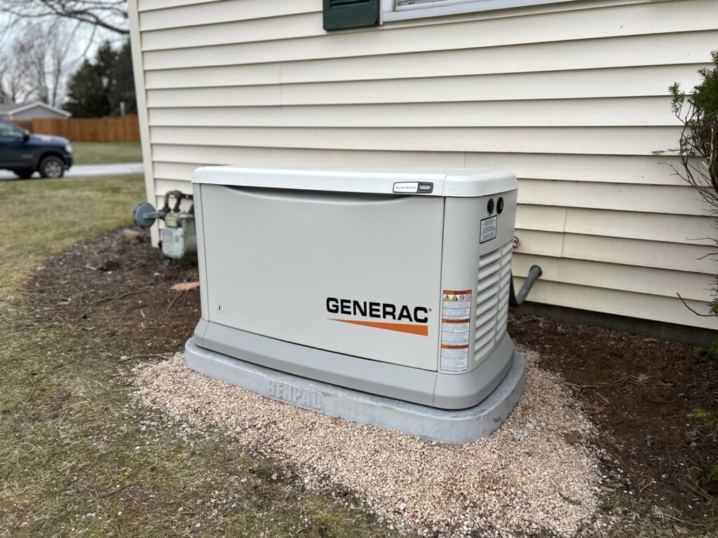 A Generac standby generator professionally installed outside a home by Ardent Electric in Erie, PA.