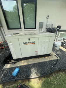 A newly installed Generac standby generator with electrical connections outside a home by Gen Central Power Systems in Houston, TX