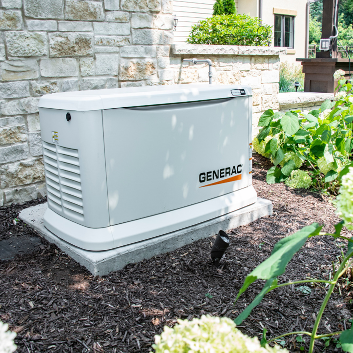 A Generac standby generator professionally installed next to a residential home by Generator Maintenance of Georgia in Atlanta, GA.