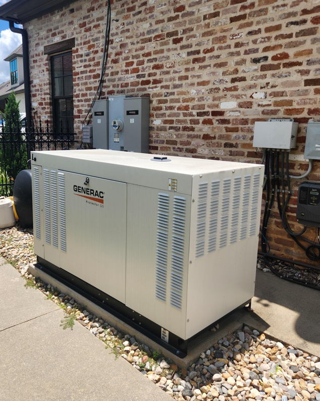 A Generac standby generator installed outside a brick building by GenTec Service and Repair in Bossier City, LA