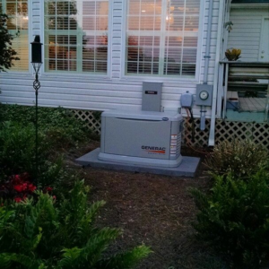 A Generac standby generator professionally installed outside a home by GGI Generators in Lexington, SC