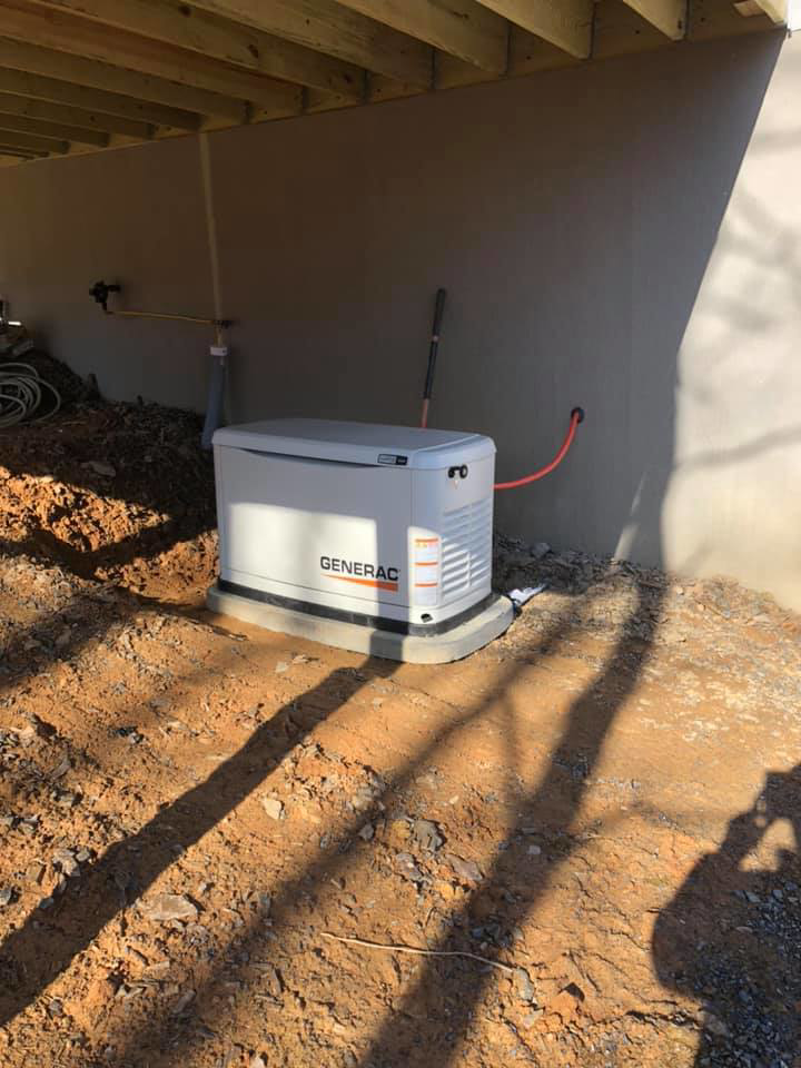 A Generac standby generator installed outside a home by Jon Chamberlain Electrical Services in Saxton, PA.