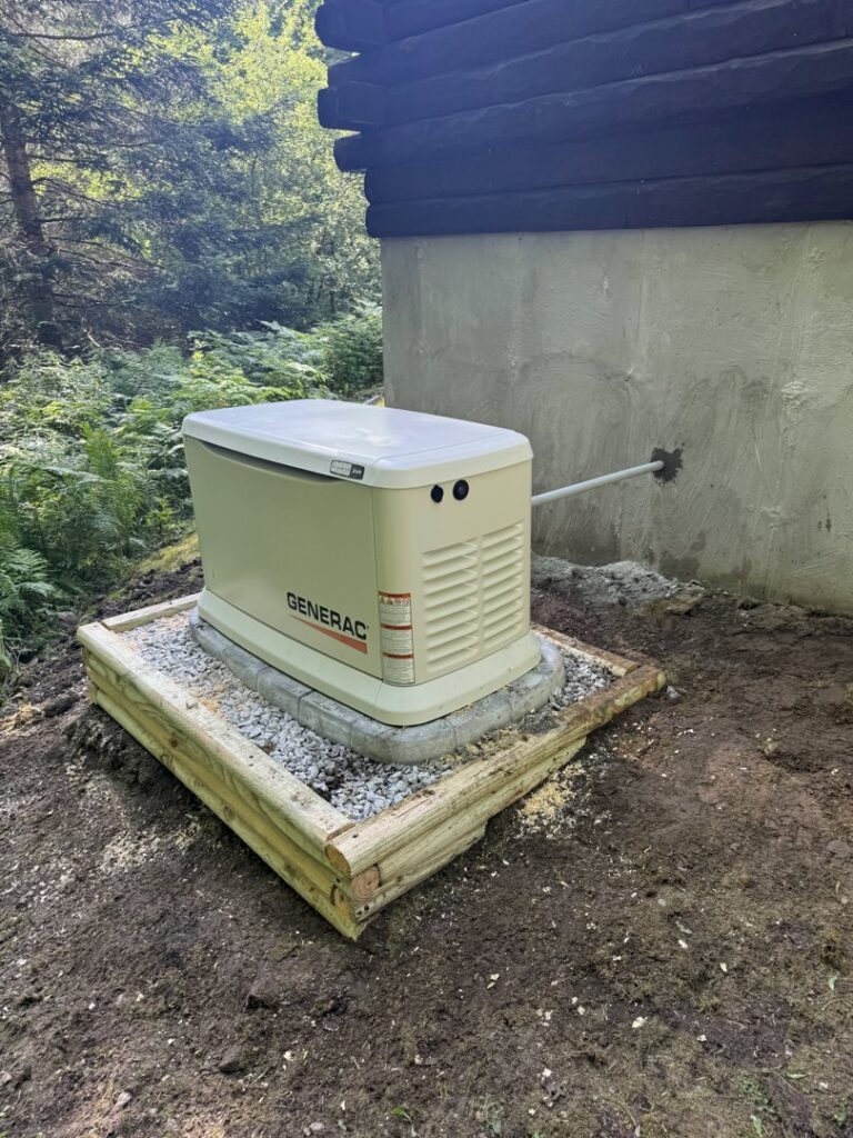 An outdoor Generac standby generator installed next to a building by Rockys electric in La Junta, CO.
