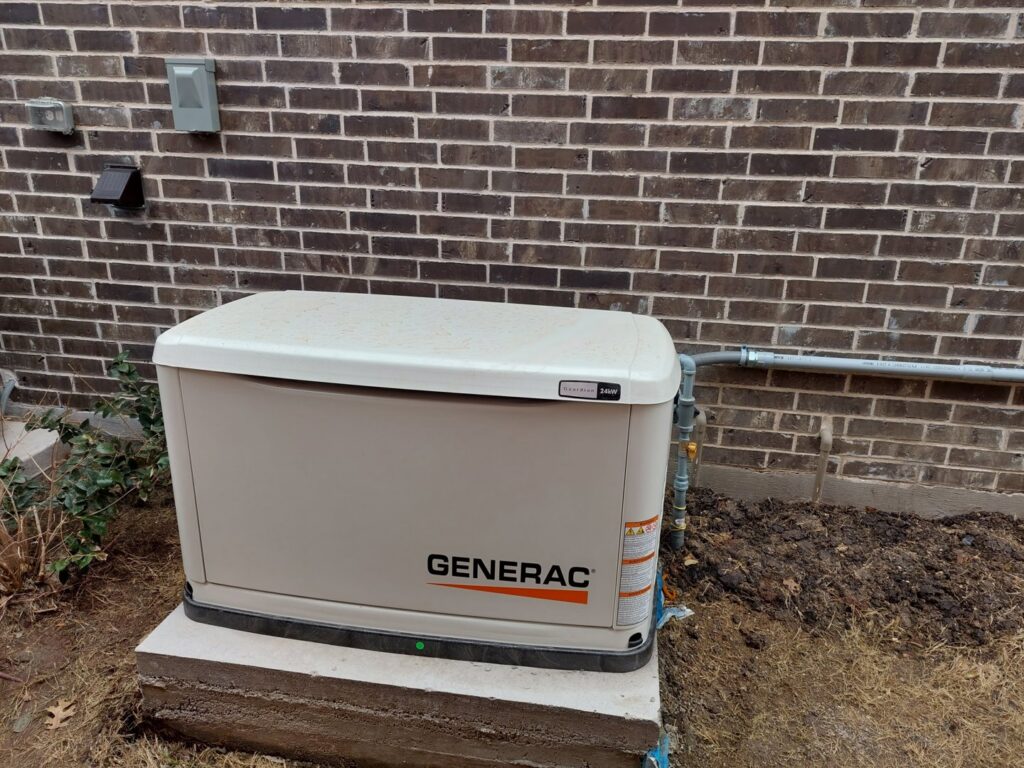 A Generac standby generator installed outside a brick home by Tesla Alarm and Electrical in Plano, TX