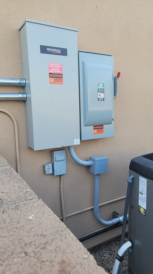A Generac automatic transfer switch and main electrical panels installed by Energysense llc in Tucson, AZ.