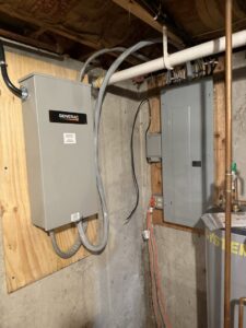 An indoor Generac transfer switch and electrical panel installed by Rockys electric in La Junta, CO.