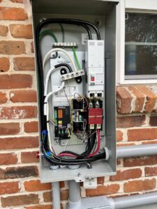 The intricate interior wiring of a Generac transfer switch, showcasing professional electrical connections by Craig's Electrical and Generator Service in Kenner, LA.