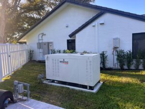 A Generac whole-home generator professionally installed outside a residence by Krakkom Electric in Sunrise, FL.
