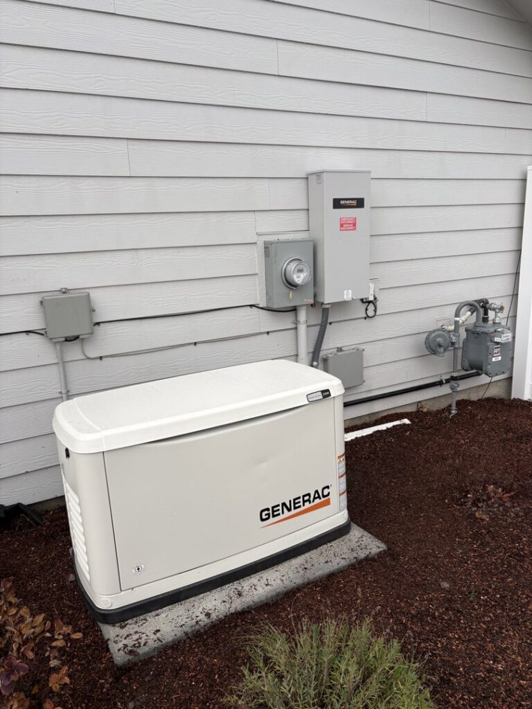 A Generac whole-house generator installed next to a residential building, a service provided by ACI Northwest Heating, Cooling & Electrical in Dalton Gardens, ID.