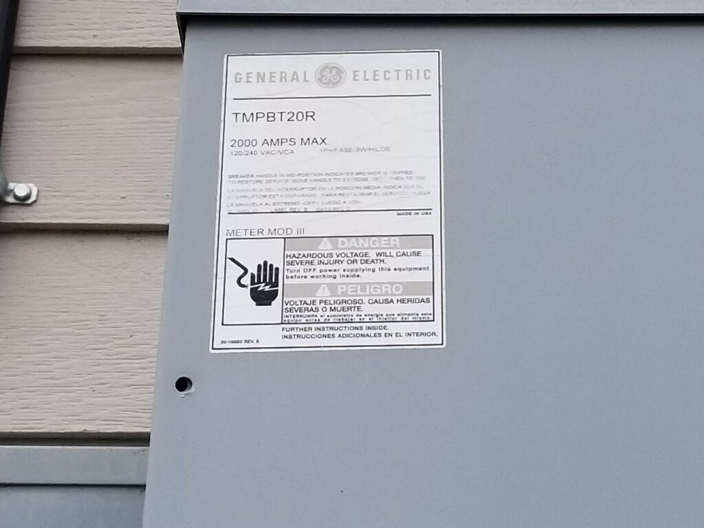 Close-up of a General Electric electrical panel label with safety warnings by Cargo Electric LLC in Philippi, WV