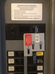 A generator interlock kit installed inside an electrical panel by Bacon Electric, LLC in Concord, NH.