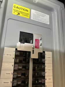 A generator interlock kit installed in an electrical panel for safety by Ardent Electric in Erie, PA.