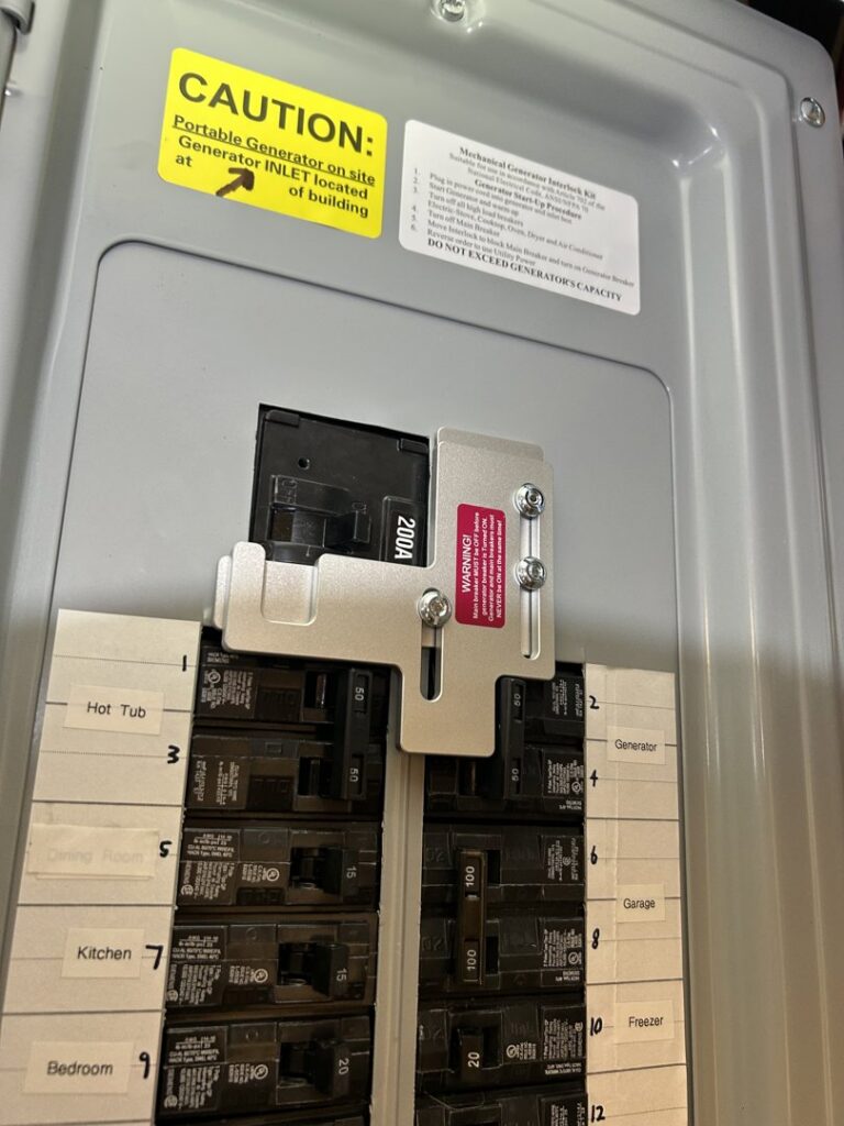 A generator interlock kit installed in an electrical panel for safety by Ardent Electric in Erie, PA.