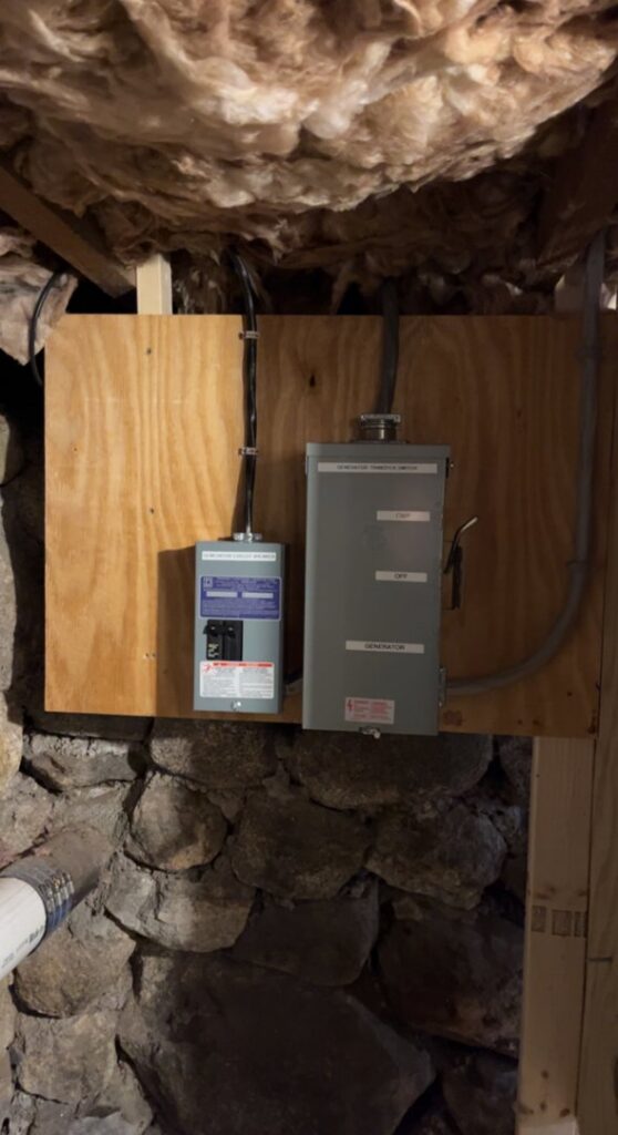 Generator transfer switch and electrical sub-panel installed in a basement by Josh LaFerriere Electric in Westbrook, ME.