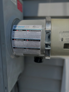 A close-up of a GenerLink generator transfer switch installed by IN Power Electric in Gorham, ME