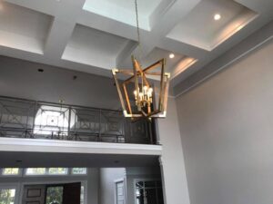A striking geometric chandelier and recessed lighting installed by TGR Electric LLC in a Carmel, IN home.