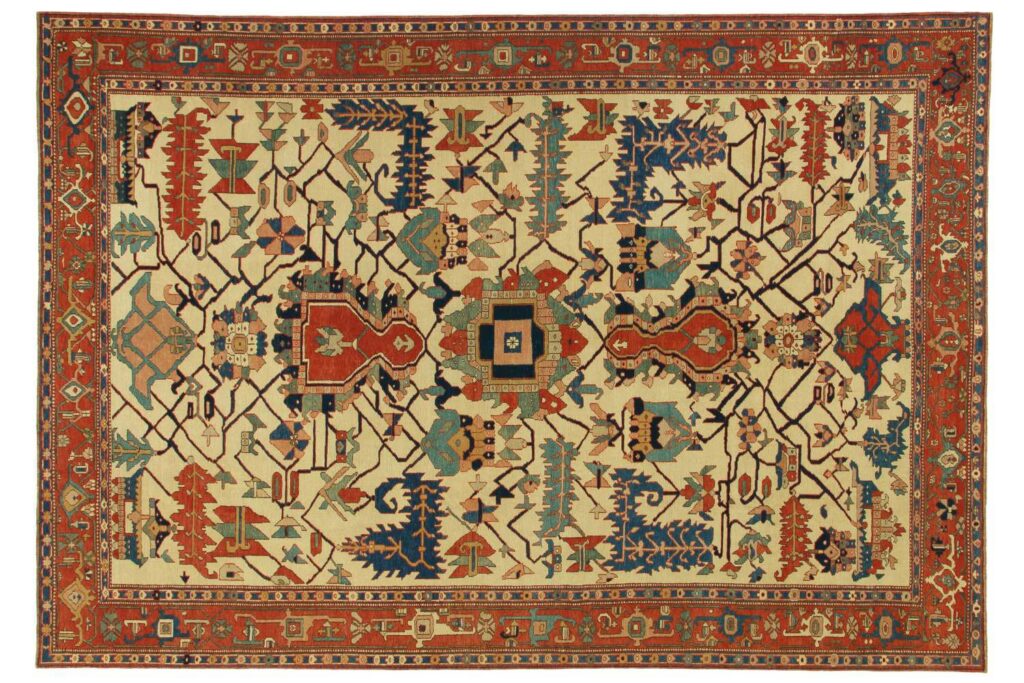 A large geometric patterned area rug with intricate designs, available from Woven Legends in Philadelphia, PA.